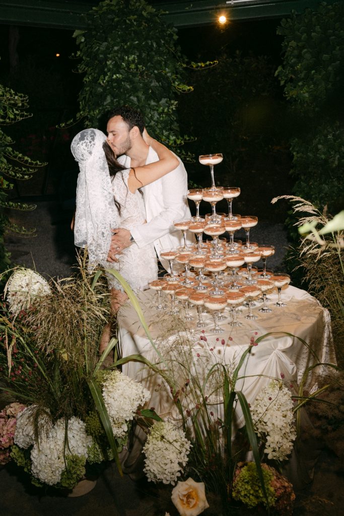 Newlyweds with tiramisu tower at Vitznauerhof, design by Studio Wedded